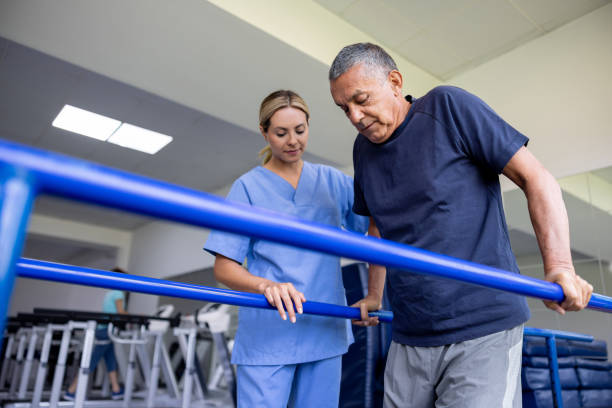 Physical therapist working with elderly woman in rehabilitation setting
